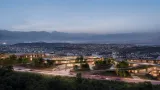 Aerial view of Mira Verde at dusk, its low-rise residences following the hillside above Tbilisi