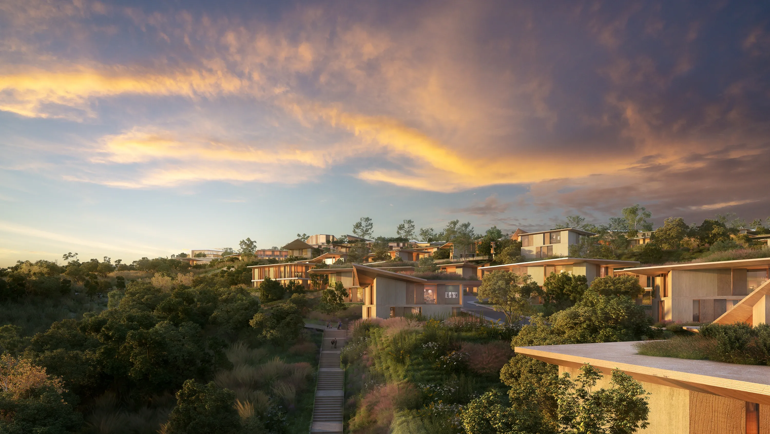 Mira Verde villas stepping down the wooded hillside at sunset
