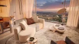 A Trussardi Casa living room with a panoramic view over Tbilisi at sunset